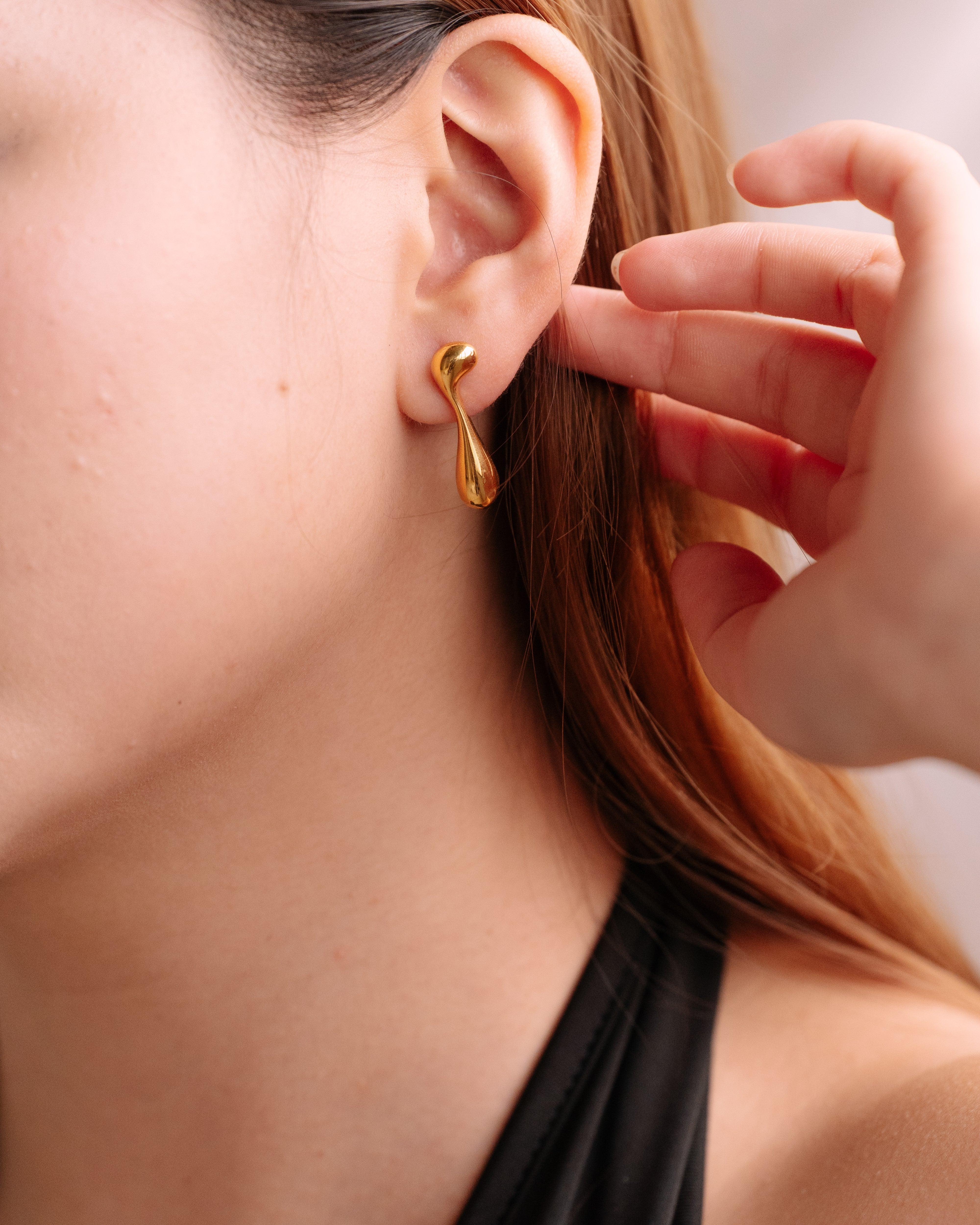 Liquefied assymetrical earrings