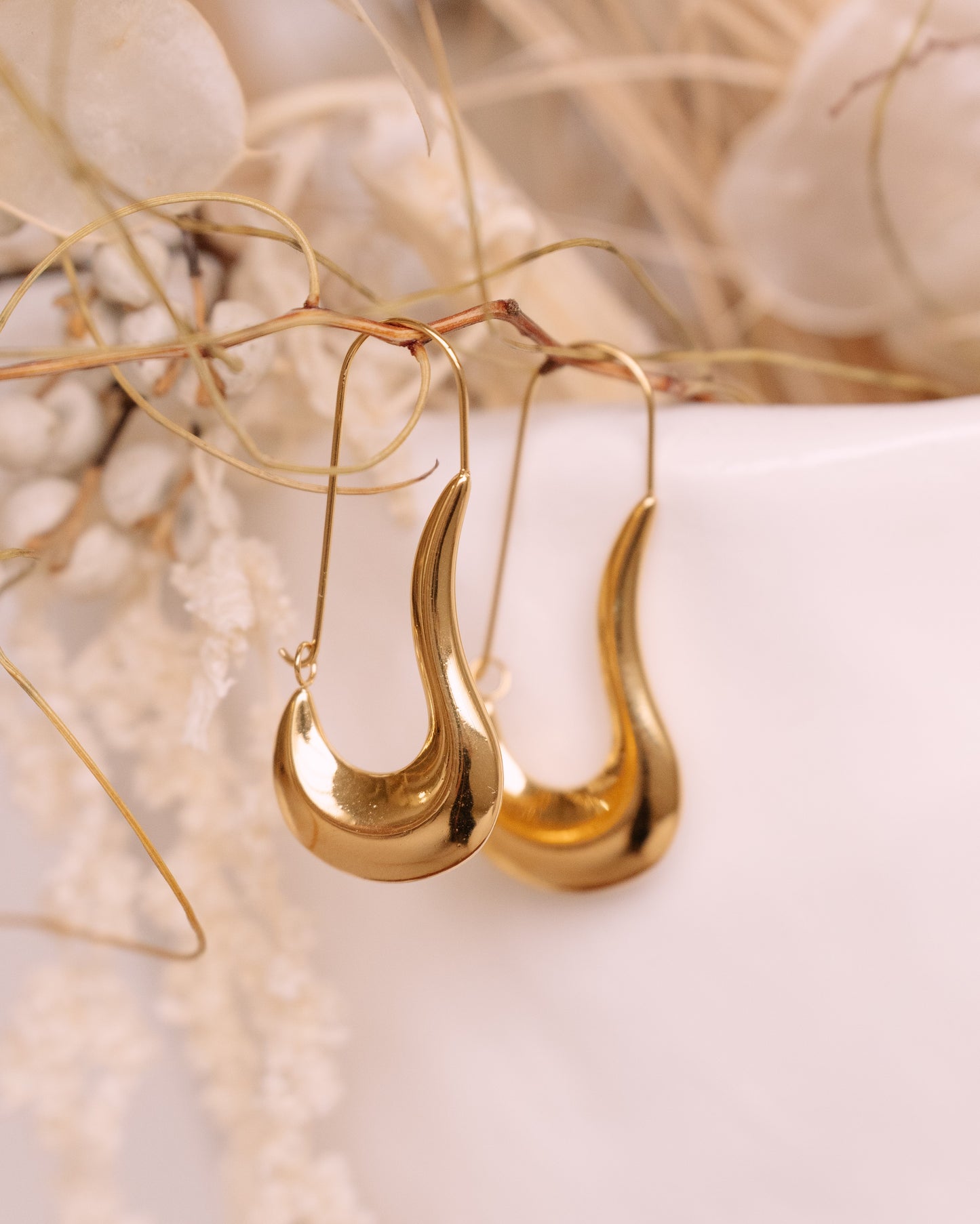 Flowing liquid statement earrings